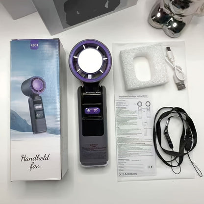 Handheld Ice Pack Fan High-Speed Semiconductor Cooling | 100-Speed Digital Display Turbo Fan with LED Light, Foldable Portable Design for Outdoor, Travel & Daily Use – Purple, Beige, Pink, Black & White