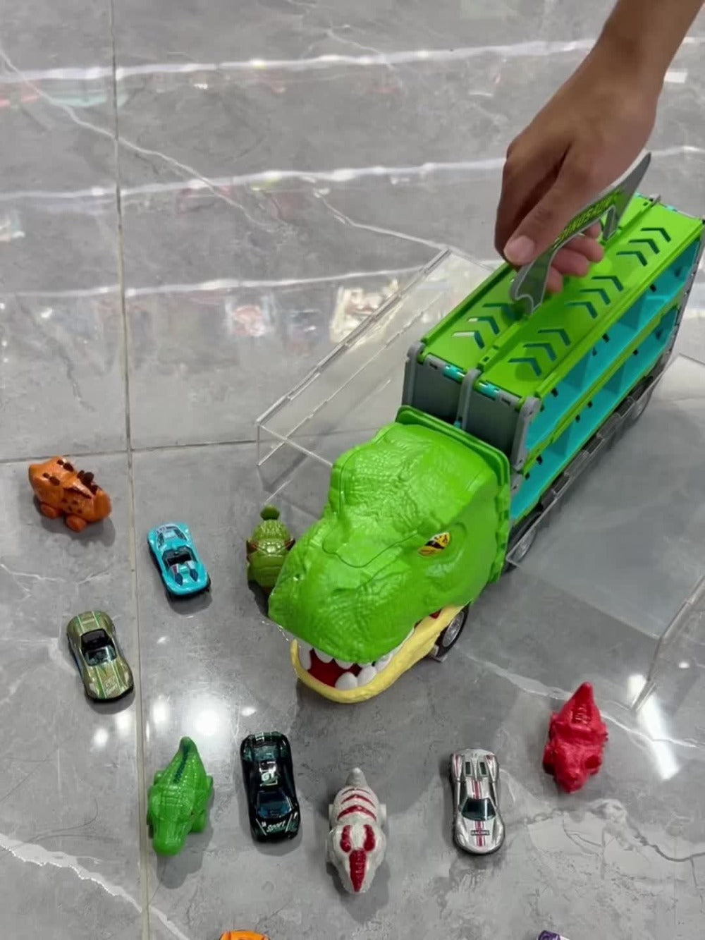 Dinosaur Truck Toys 13-in-1 Transport Carrier with 63-Inch Foldable Race Track | 6 Dino Cars + 6 Die-Cast Cars | 2-Player Racing Mode | Kids Birthday Christmas Gift