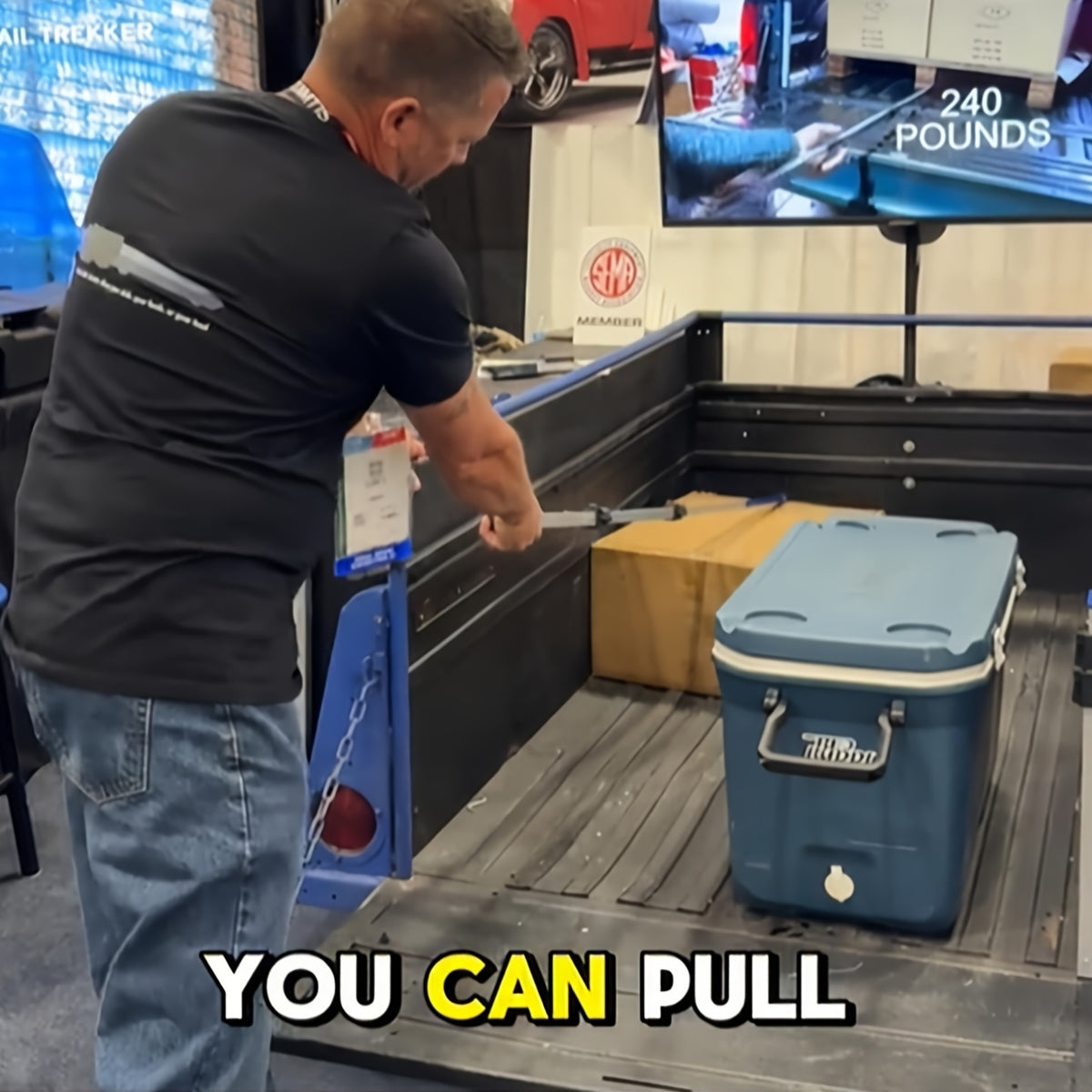 A Robust Stainless Steel Telescopic Grabber for Truck Beds, Featuring a Retractable Handle. This Heavy-Duty Tool Is Designed for Cargo Retrieval, Making It for easy to Lift And Move Heavy Items. It Serves As a Practical Accessory for Trucks with a D