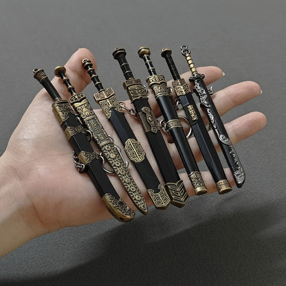 Miniature Metal Swords Set 7pcs Ancient-Inspired Collectible Pendant with Sheath – Military Theme Durable Metal Mini Sword Toy Gift for Anime Game Enthusiasts Ages 14+
